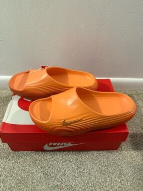 Nike Bright Orange Slide Sandals with Gold Swoosh